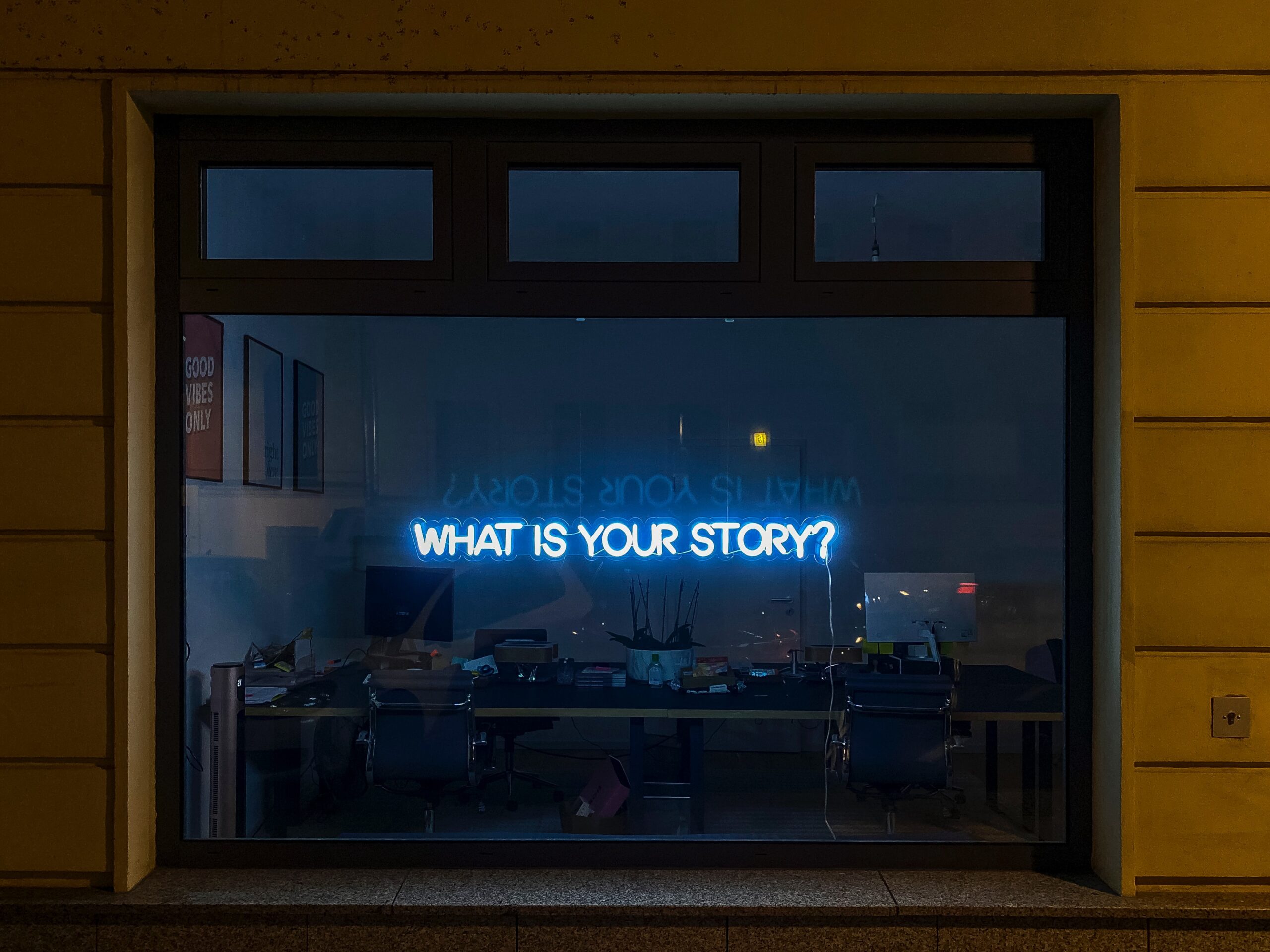 Neon Blue Sign That Reads What is Your Story?